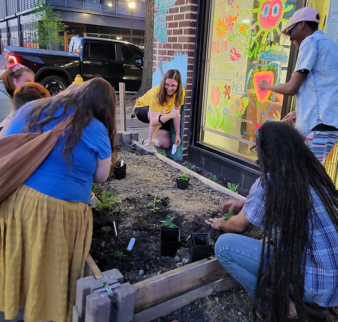 Volunteers working on the community garden at RUMAH